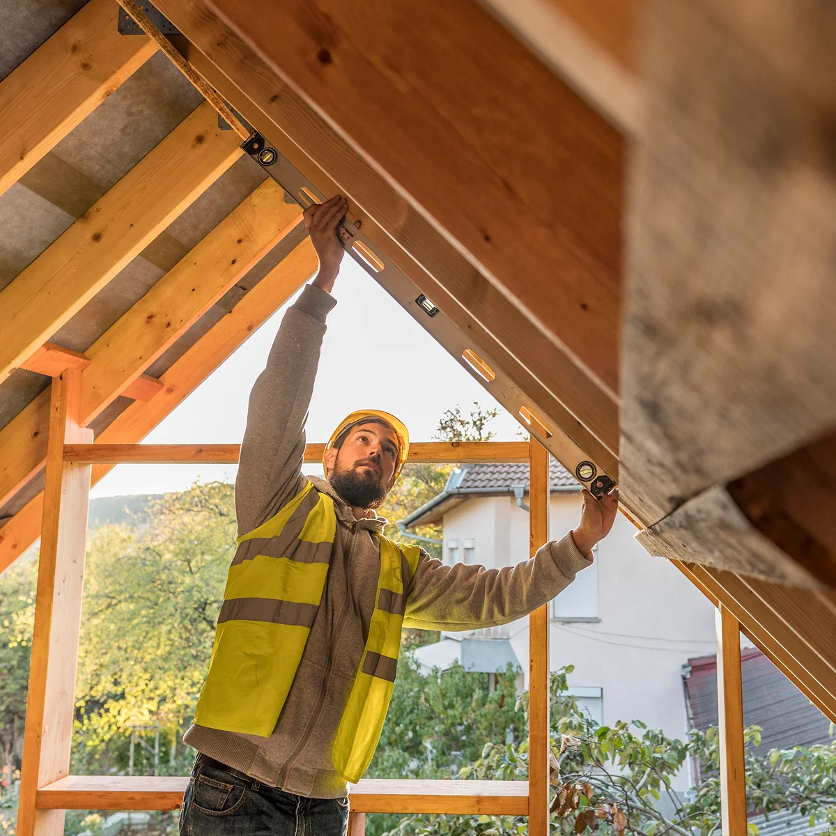 Carpenter working on roof construction