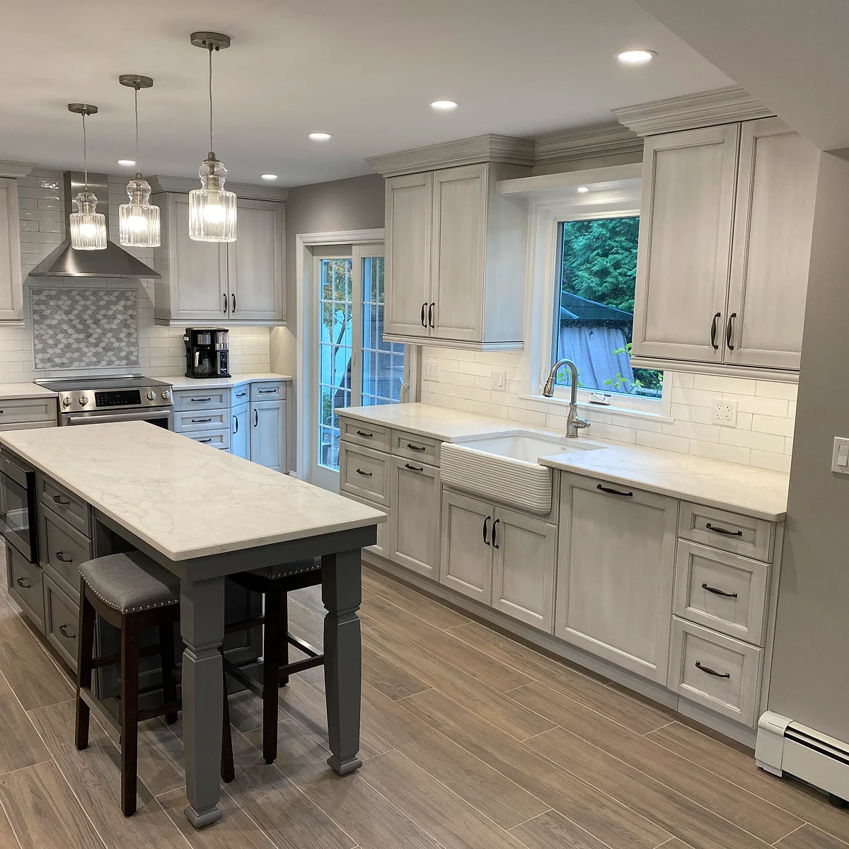 Gray kitchen with farmhouse sink island