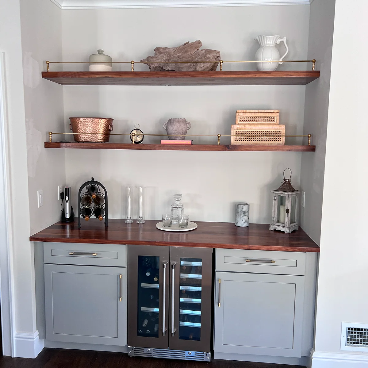 Gray wet bar with floating wood shelves