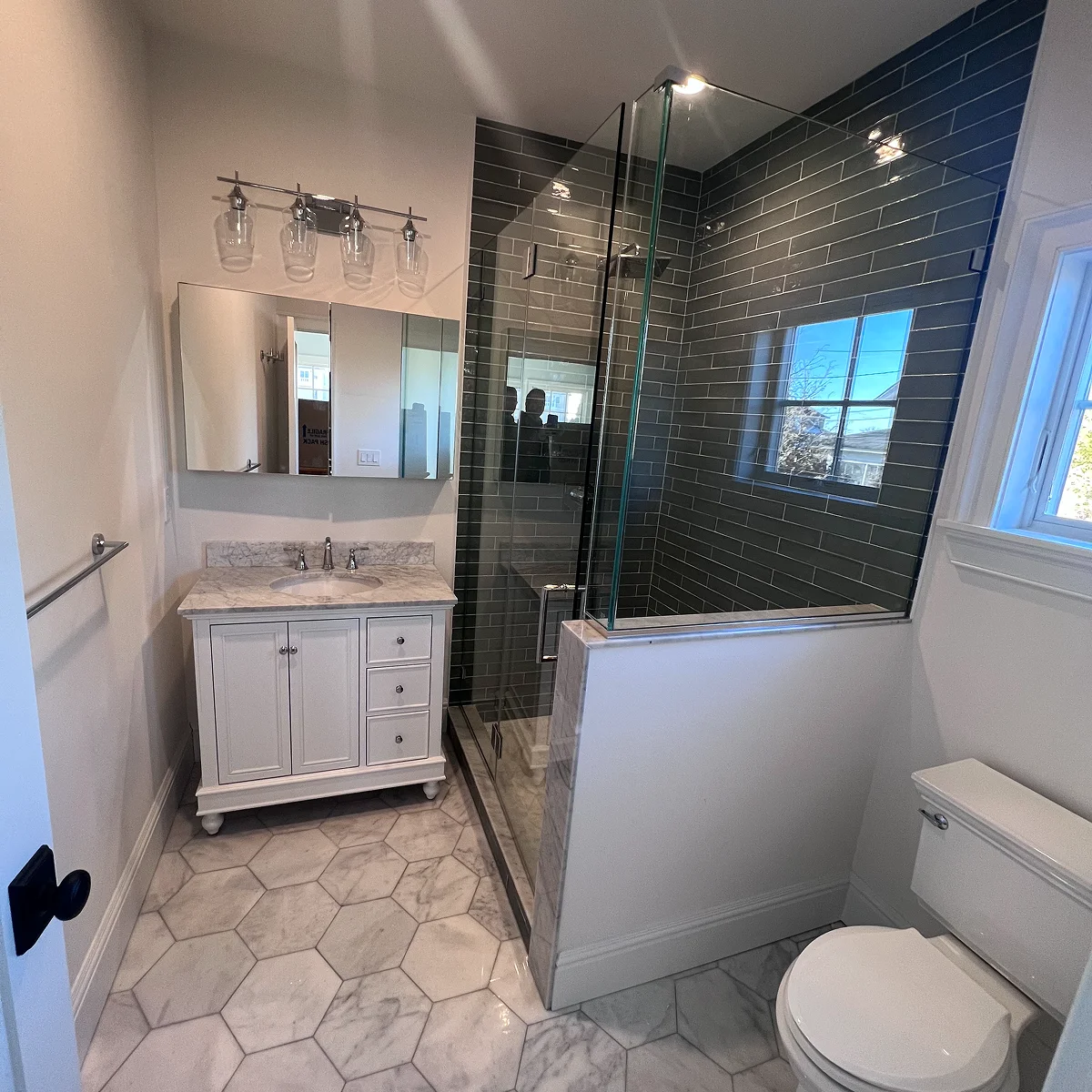 Green subway tile glass shower bathroom