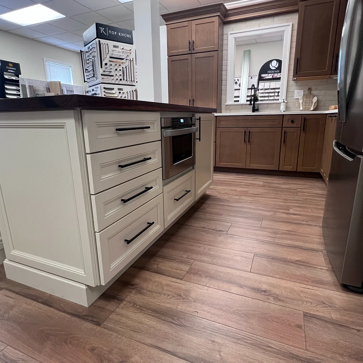 White island and wood kitchen display inside the IMC Design showroom
