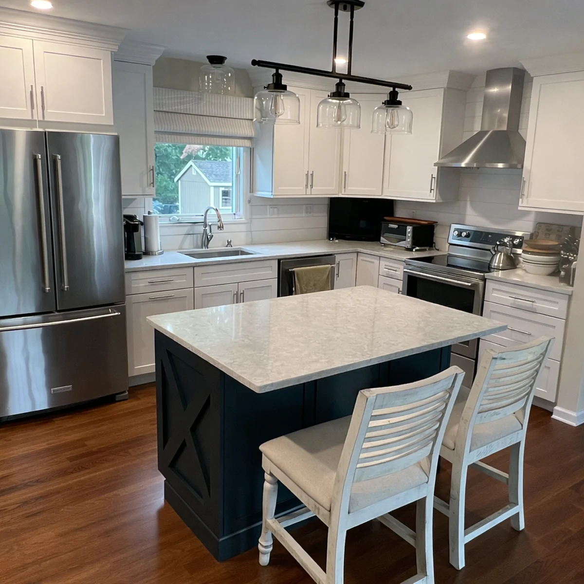 White kitchen with black island