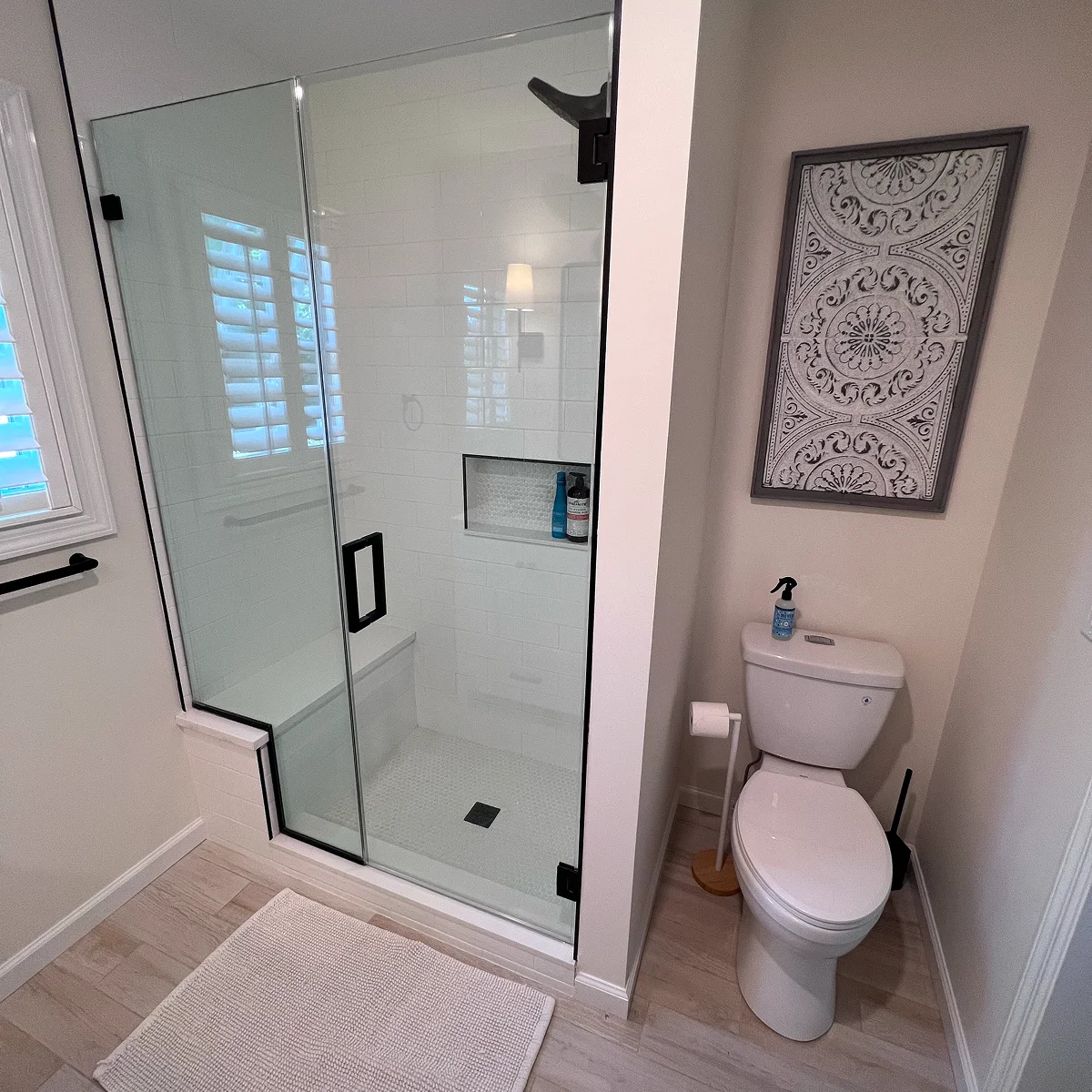 Bright white tile and glass shower bathroom