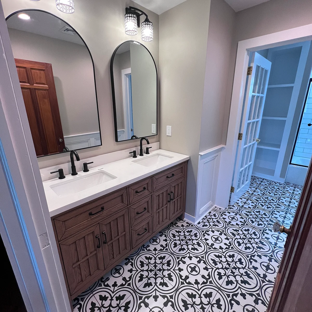 Wood double vanity with patterned floor
